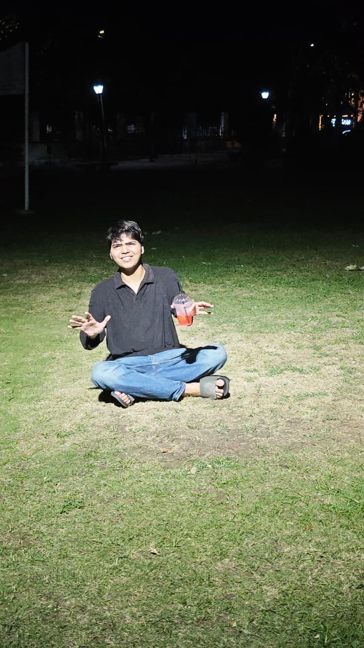 Chaitanya sitting under night lights