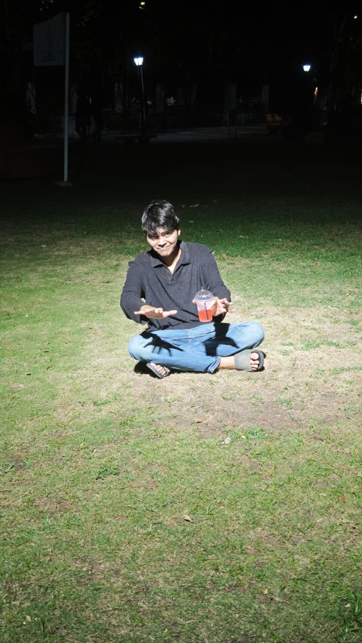 Chaitanya seated at night on grass